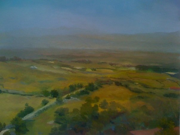 A landscape painting from Italy. Green hills and fields on a hazy blue day. 